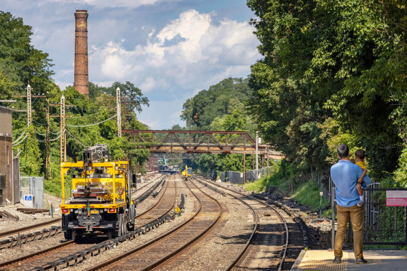 A man and his son survey the work vehicles at Dobbs Ferry